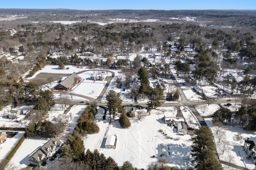 87 Landham Road Sudbury, MA 01776 - Photo 10 of 16 an aerial view of a city with lots of residential buildings