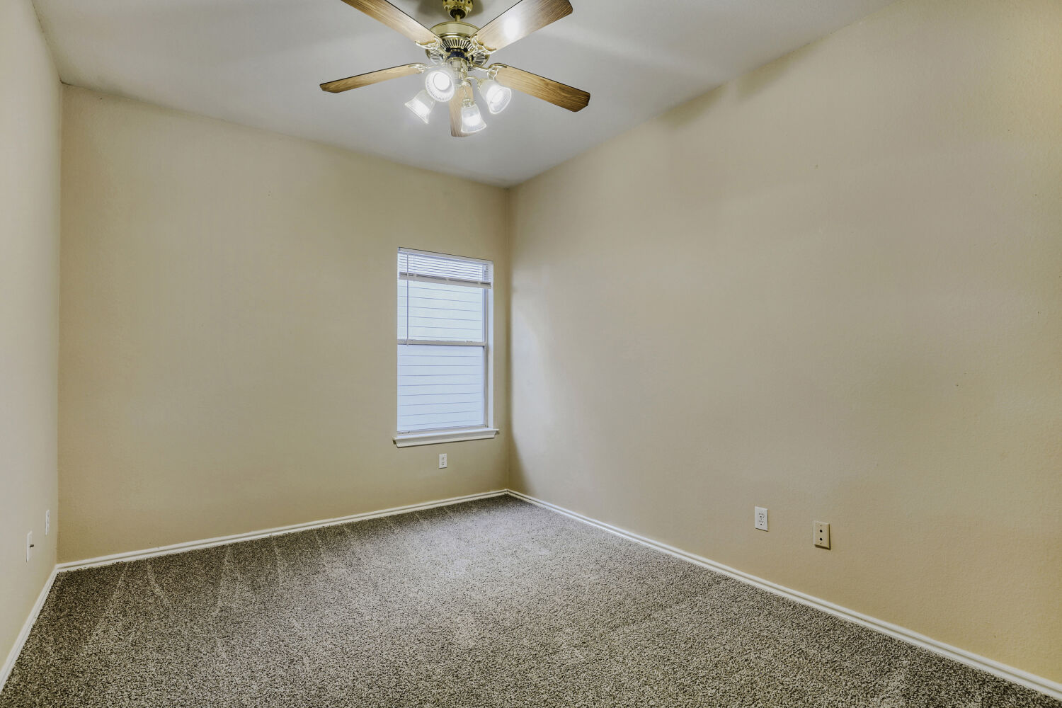 11502 Liberty Street Manor, TX 78653 - Photo 12 of 18 an empty room with a window and a fan