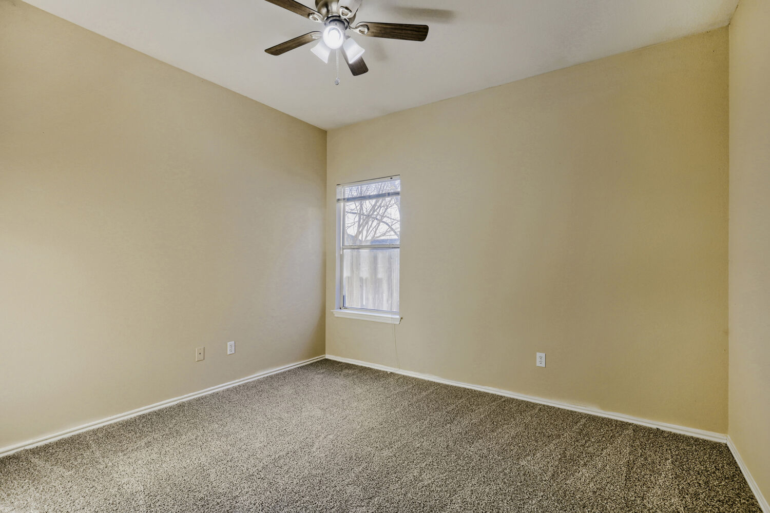 11502 Liberty Street Manor, TX 78653 - Photo 13 of 18 an empty room with windows and fan