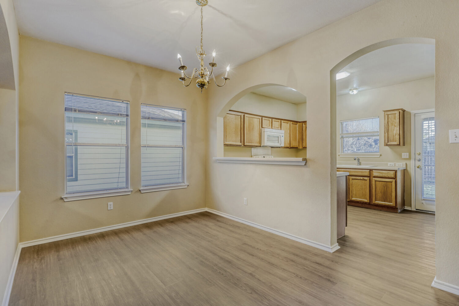 11502 Liberty Street Manor, TX 78653 - Photo 5 of 18 wooden floor in an empty room with a window