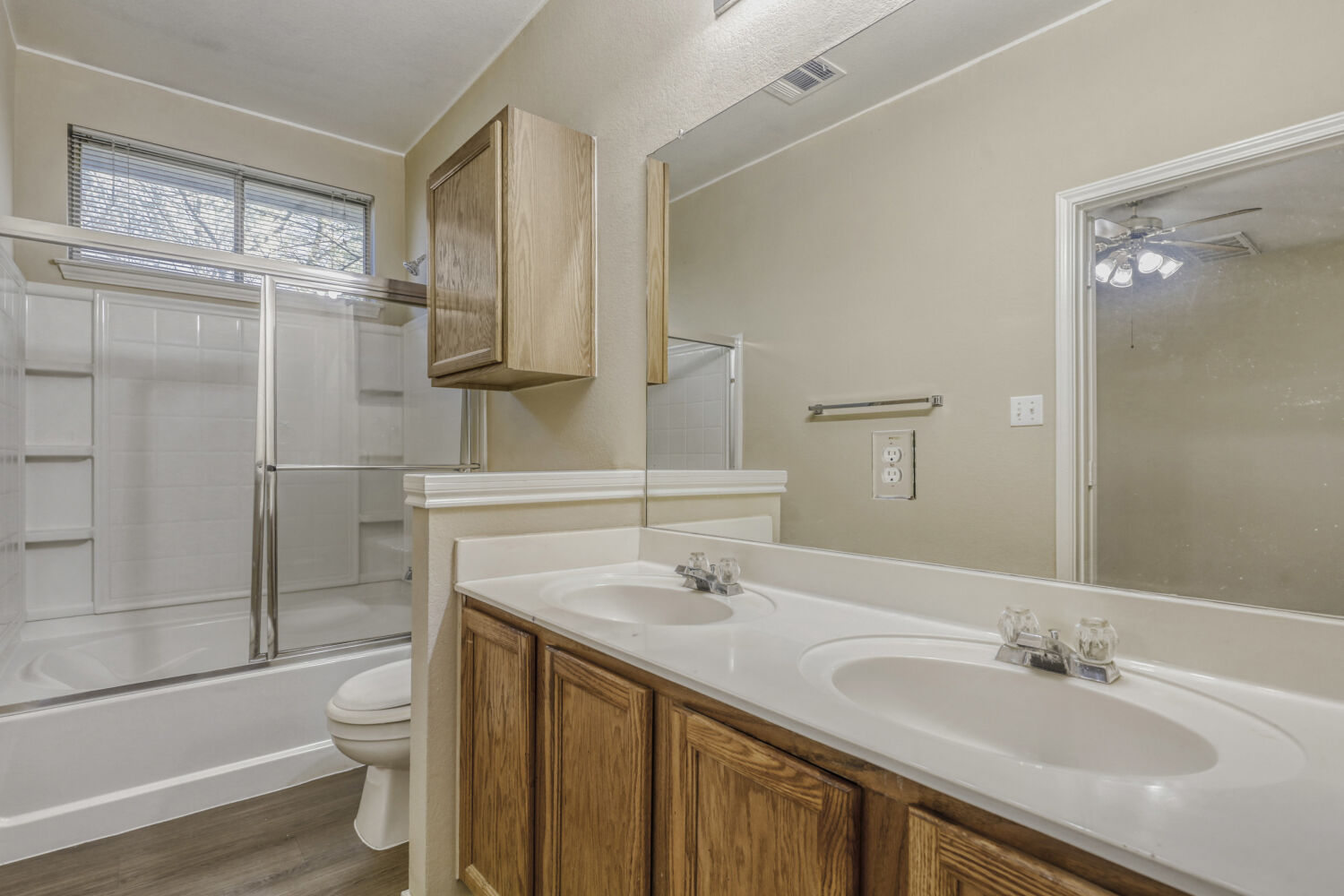 11502 Liberty Street Manor, TX 78653 - Photo 10 of 18 a bathroom with a granite countertop sink toilet and shower