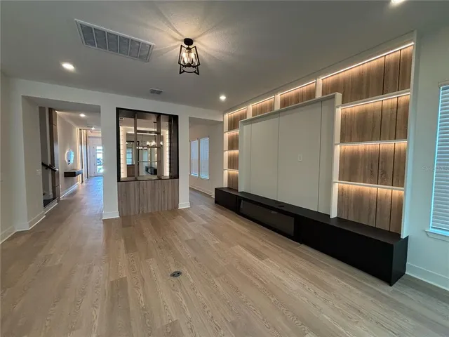 a view of gallery with wooden floor