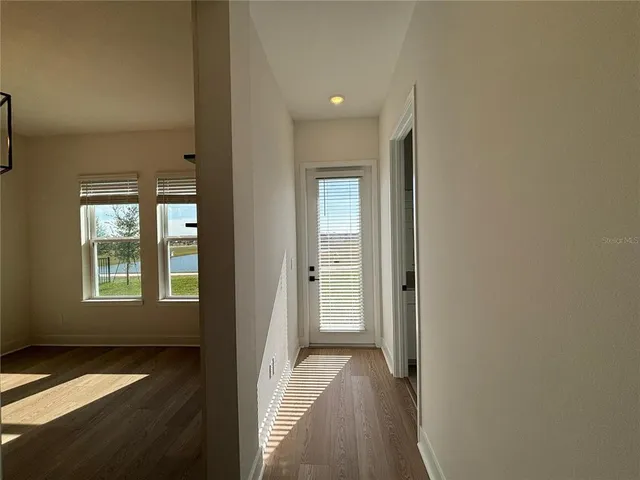 a view of hallway with windows
