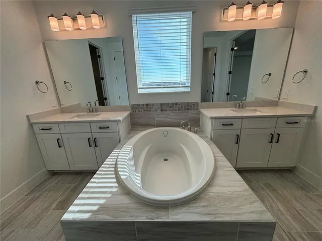 a bathroom with a shower and a glass door