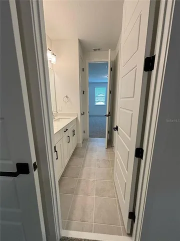 a bathroom with a sink a toilet a shower and a mirror