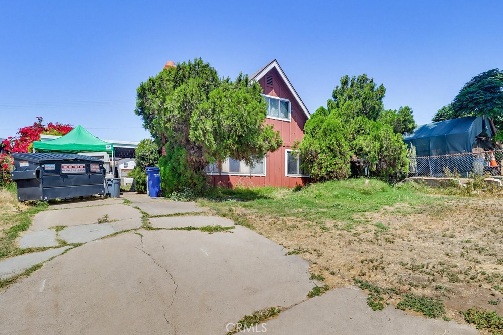 736 Sacramento Avenue Spring Valley, CA 91977 - Photo 33 of 33 a front view of a house with a yard and a garage