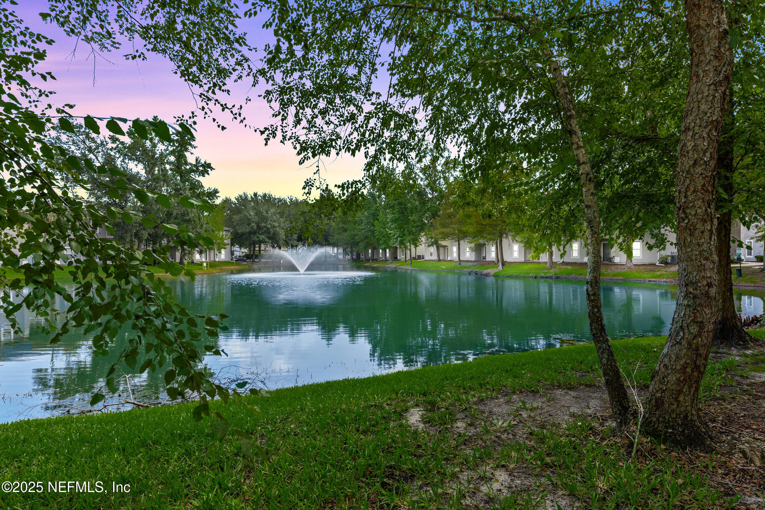 6094 Maggies Circle, Unit 109 Jacksonville, FL 32244 - Photo 1 of 30 a view of a lake with a yard