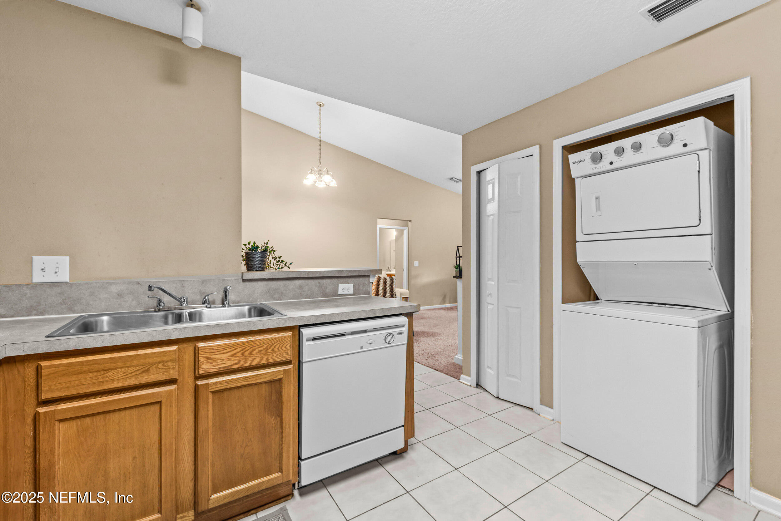 6094 Maggies Circle, Unit 109 Jacksonville, FL 32244 - Photo 13 of 30 a kitchen with a sink and cabinets