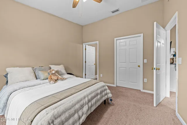 a bedroom with a bed and a cabinets