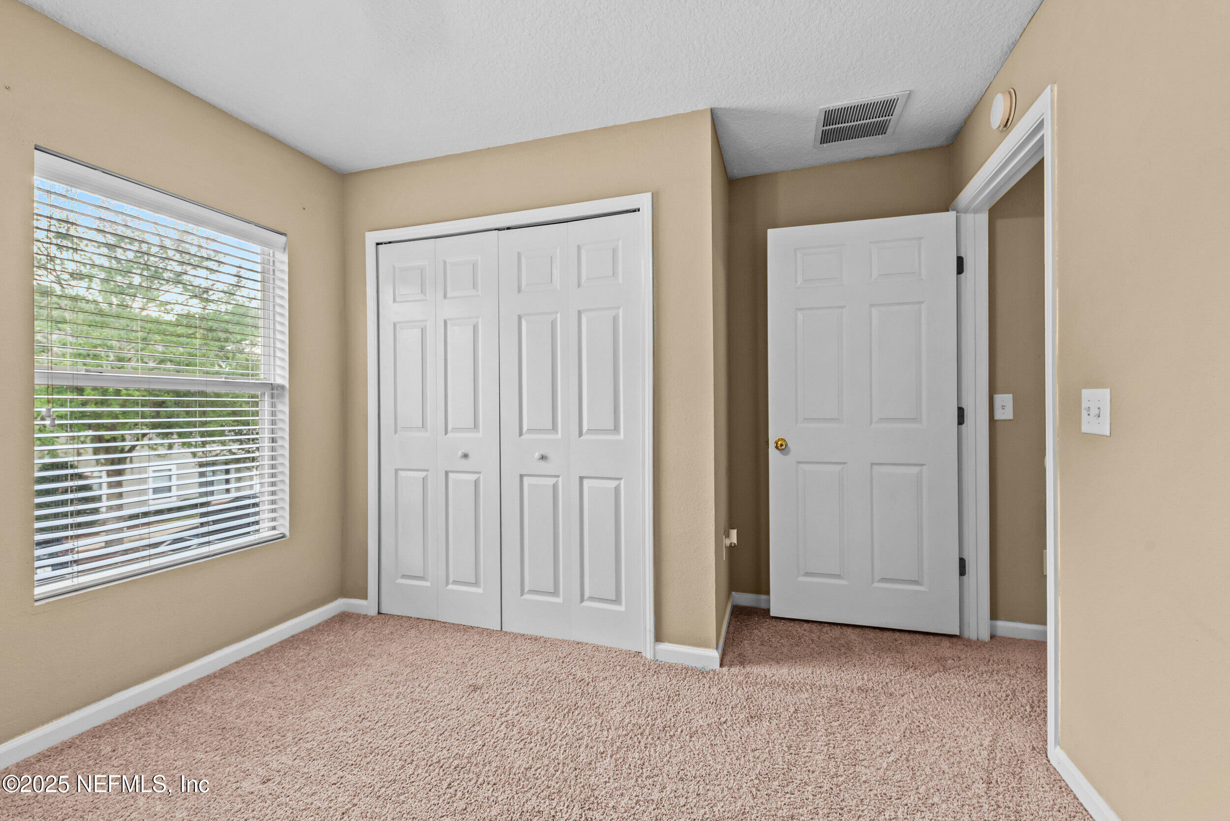 6094 Maggies Circle, Unit 109 Jacksonville, FL 32244 - Photo 18 of 30 an empty room with windows