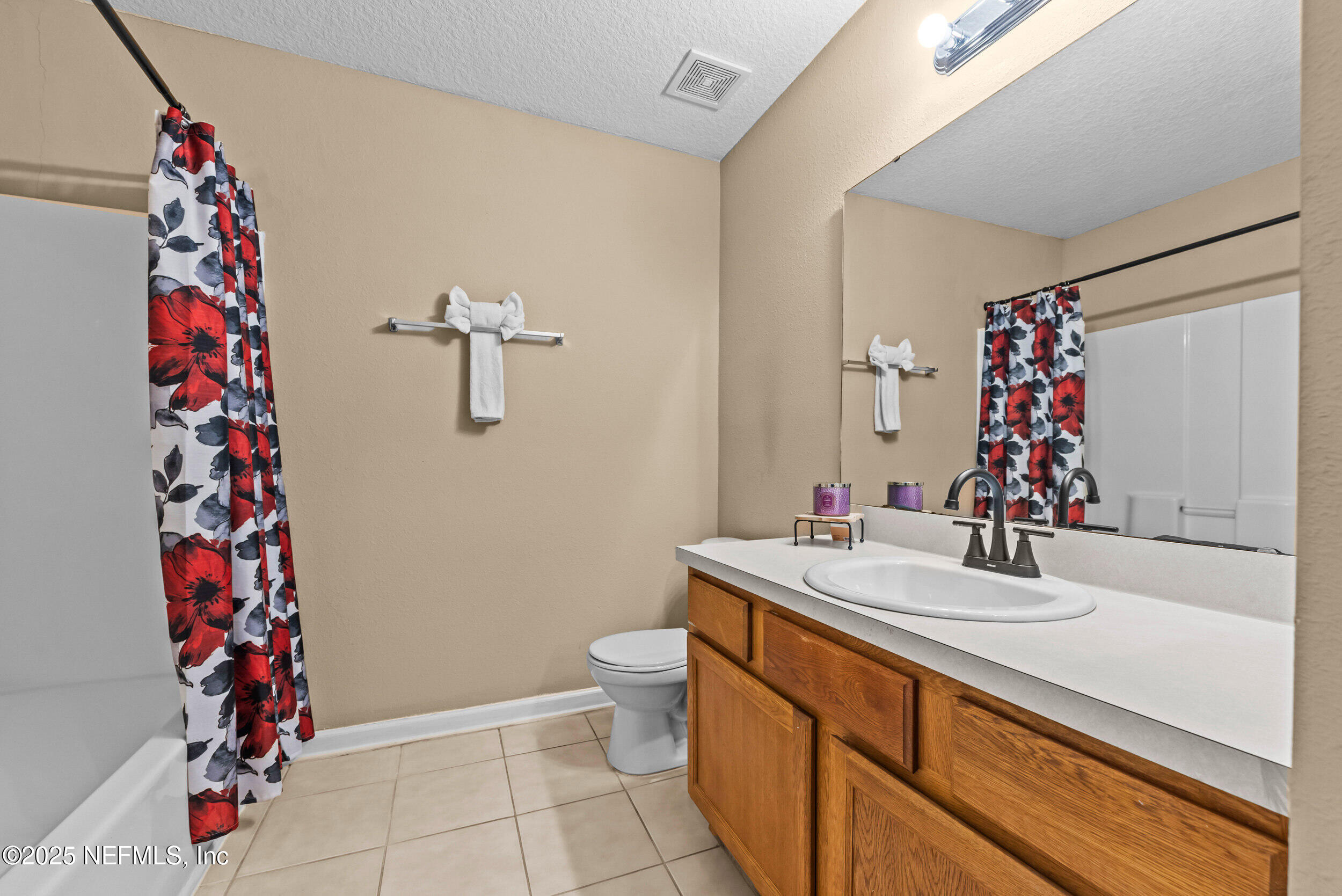 6094 Maggies Circle, Unit 109 Jacksonville, FL 32244 - Photo 19 of 30 a bathroom with a sink toilet and shower
