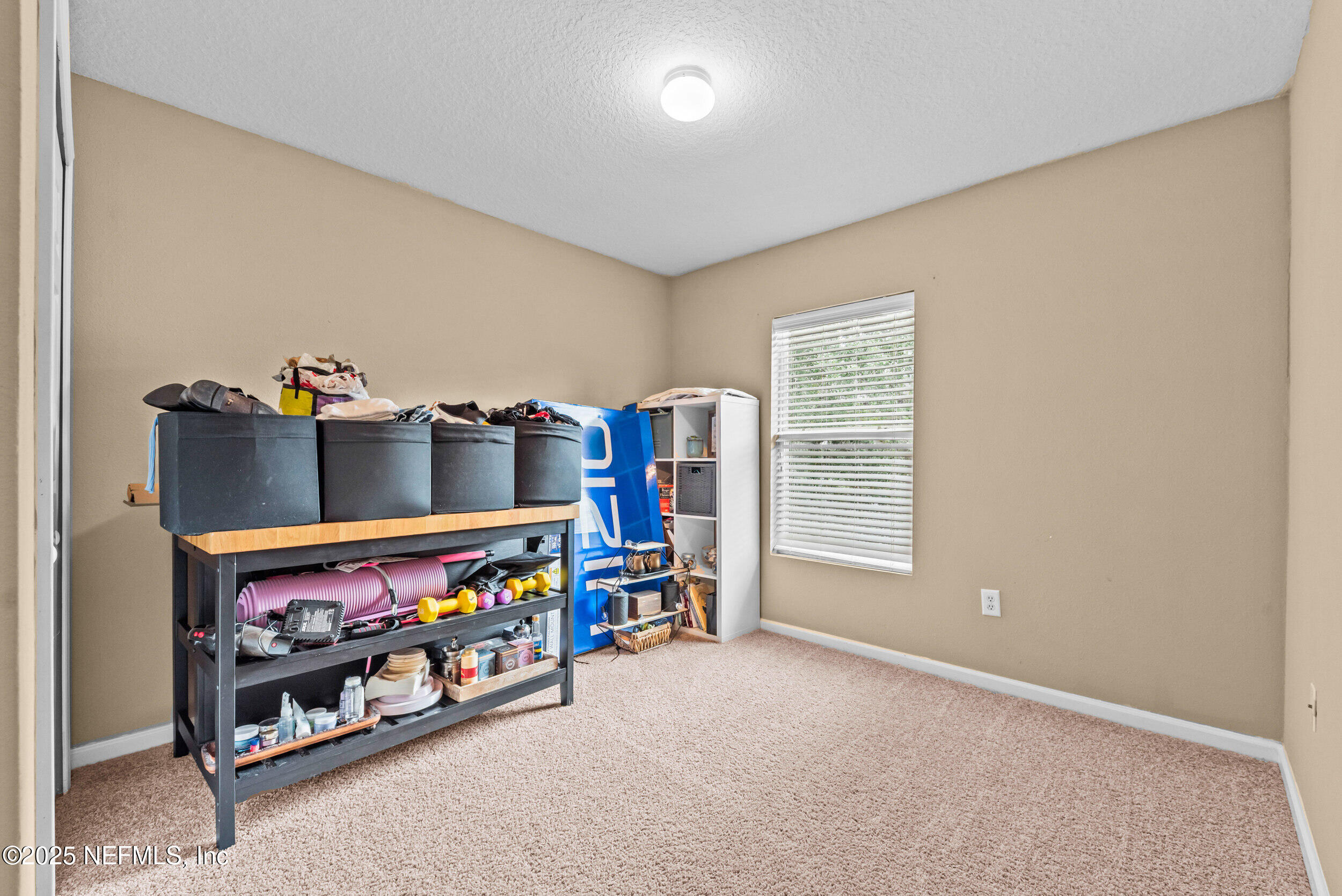 6094 Maggies Circle, Unit 109 Jacksonville, FL 32244 - Photo 20 of 30 a room with toys and a baby crib