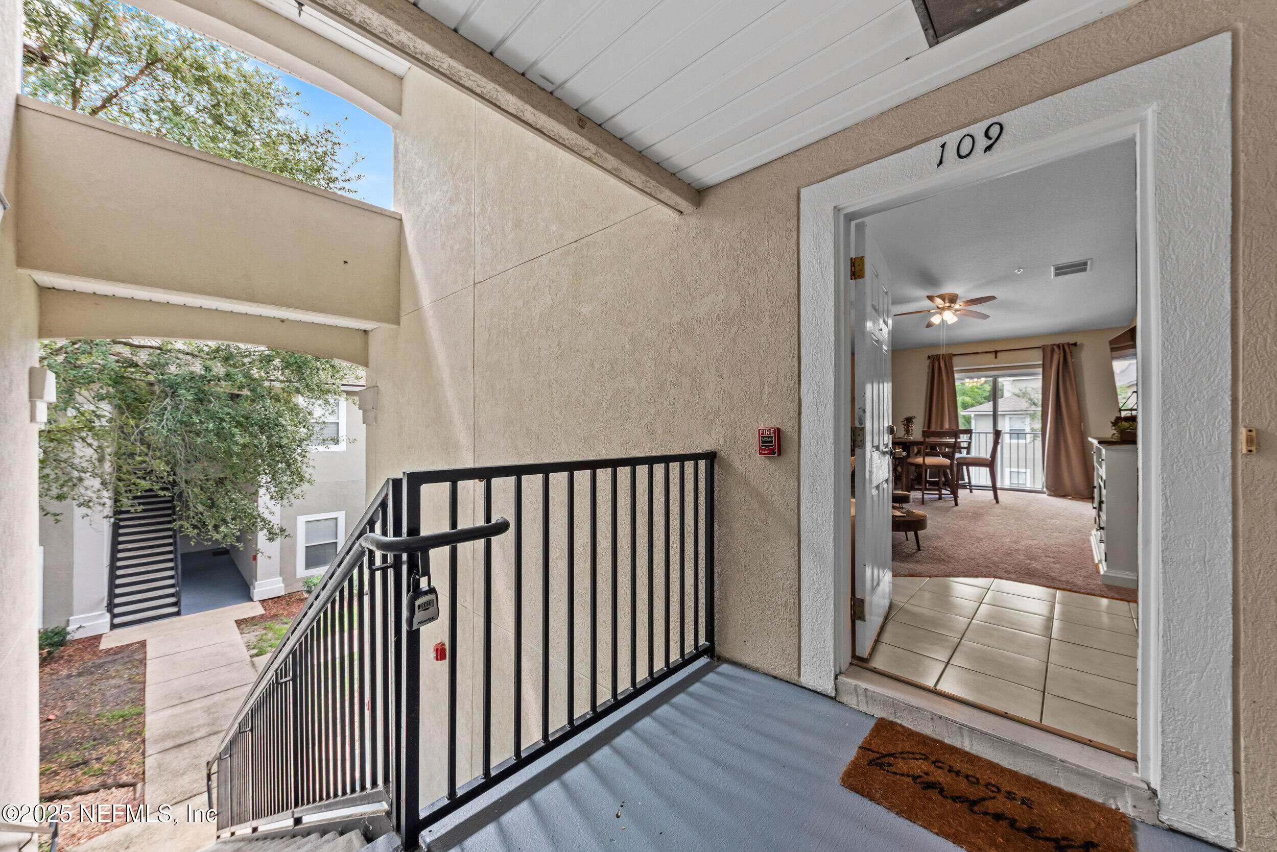 6094 Maggies Circle, Unit 109 Jacksonville, FL 32244 - Photo 3 of 30 a view of a hallway view with wooden floor and staircase