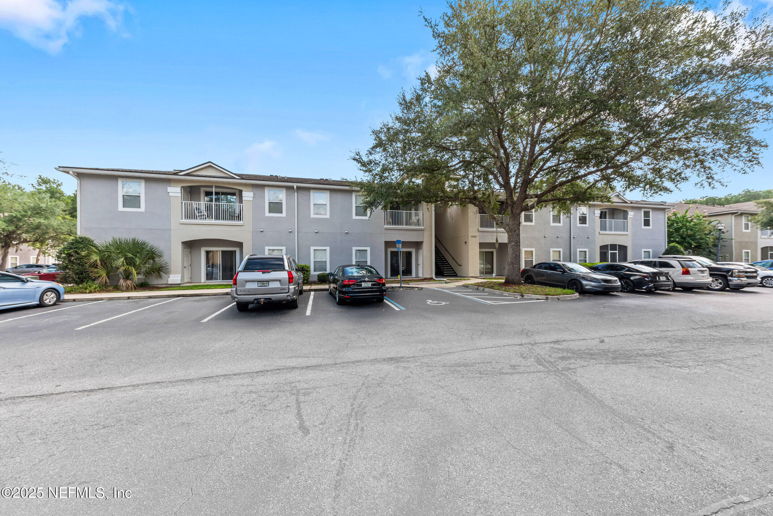 6094 Maggies Circle, Unit 109 Jacksonville, FL 32244 - Photo 5 of 30 a car parked in front of a building
