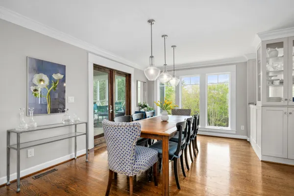 a view of a dining room with furniture window and wooden floor