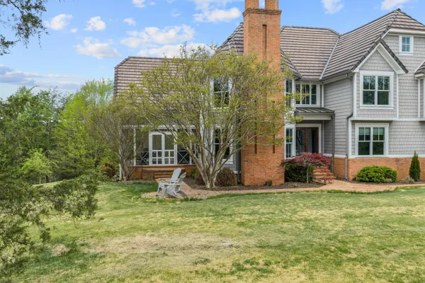 a aerial view of a house with a yard