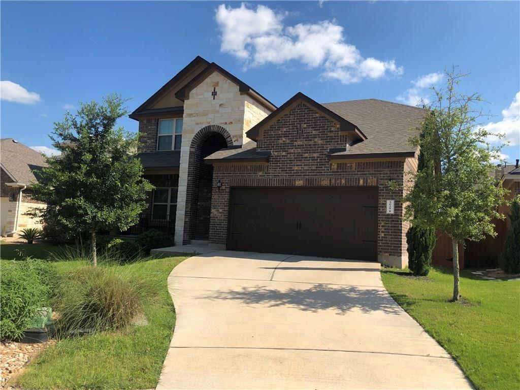 5629 Rio Chama Cove Austin, TX 78738 - Photo 2 of 34 A striking facade with brick and stone accents provides inviting curb appeal.