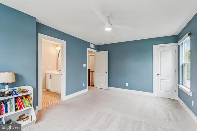 a view of an empty room and a window