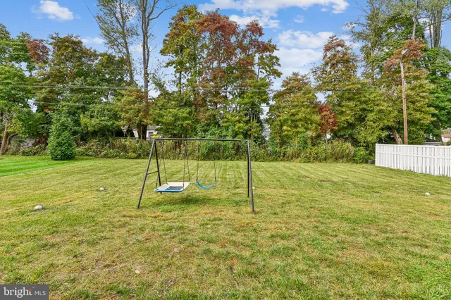 a house view with a play ground