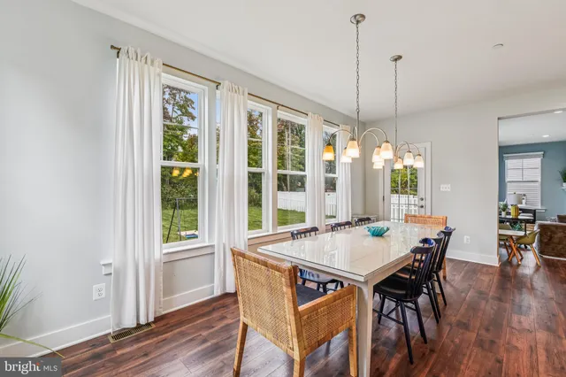 a dining room with furniture window wooden floor