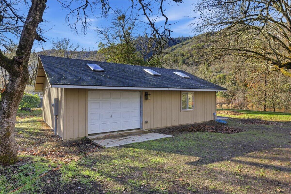1401 Upper River Road Gold Hill, OR 97525 - Photo 5 of 8 a front view of a house with a yard