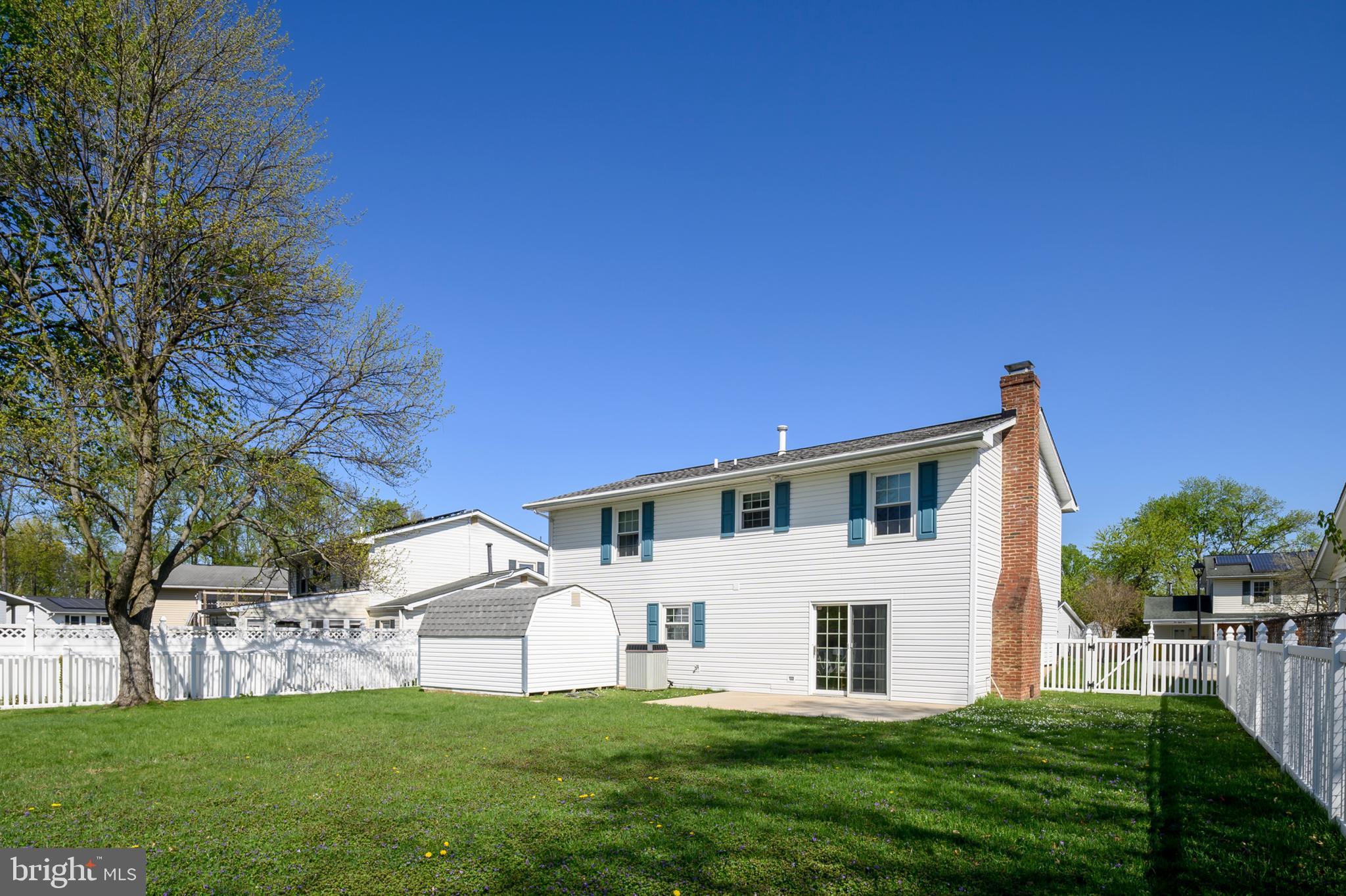 982 Fall Cir Way Gambrills, MD 21054 - Photo 29 of 32 a front view of a house with a yard and trees