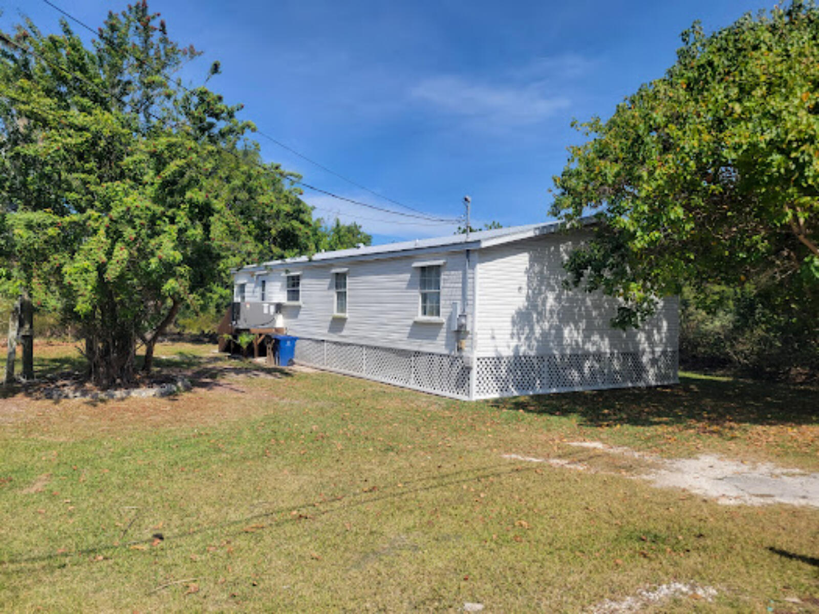 31037 Ave D Big Pine Key, FL 33043 - Photo 14 of 20 a view of a house with a big yard