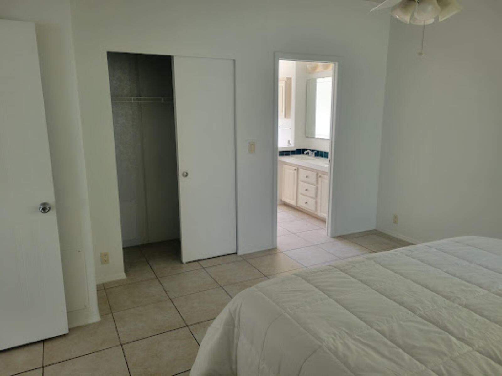 31037 Ave D Big Pine Key, FL 33043 - Photo 18 of 20 a view of a bedroom with cabinet and mirror