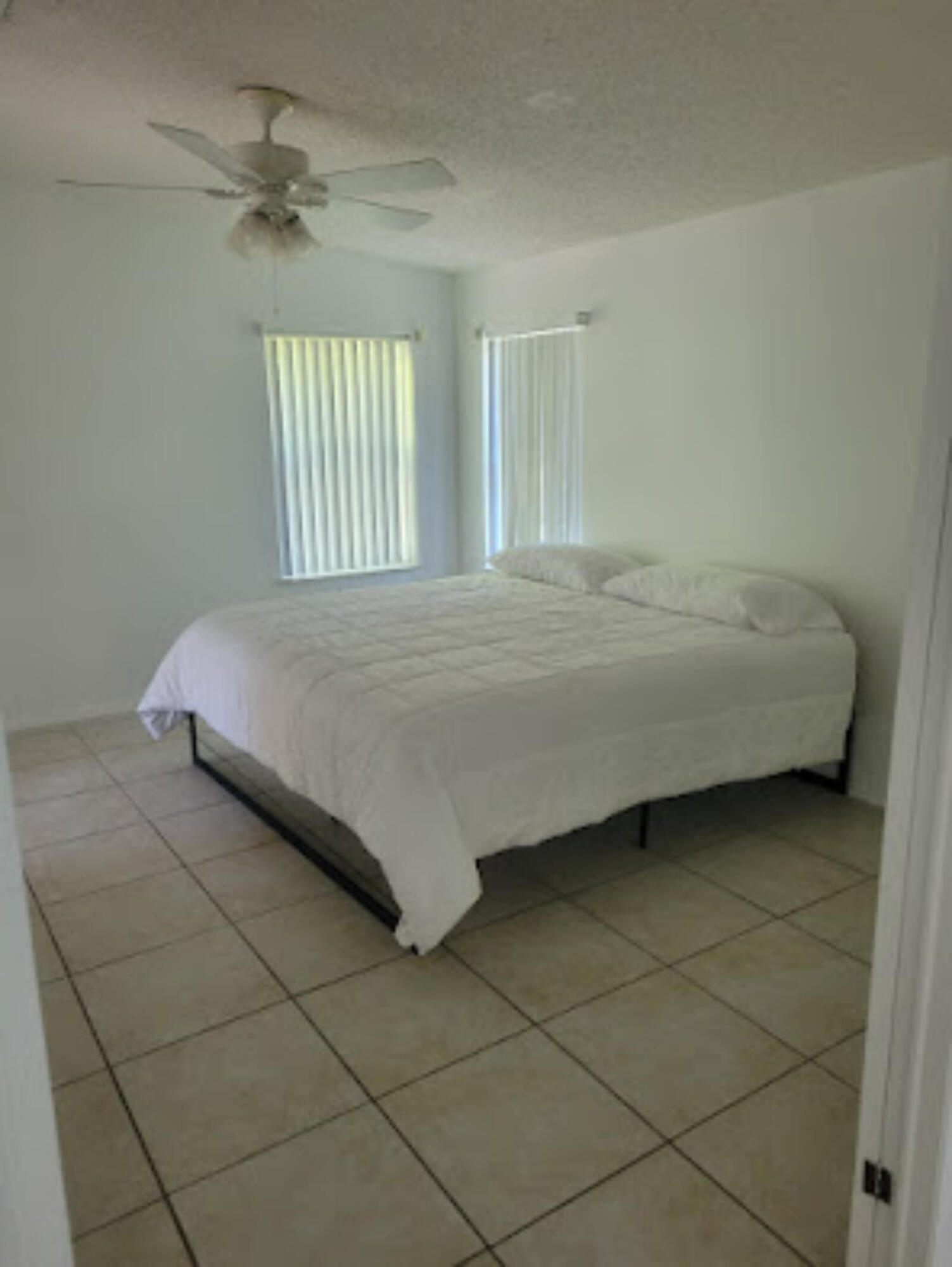 31037 Ave D Big Pine Key, FL 33043 - Photo 4 of 20 a bedroom with a bed and a window