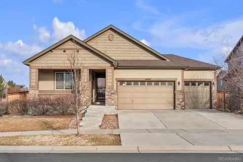 a front view of a house with garage