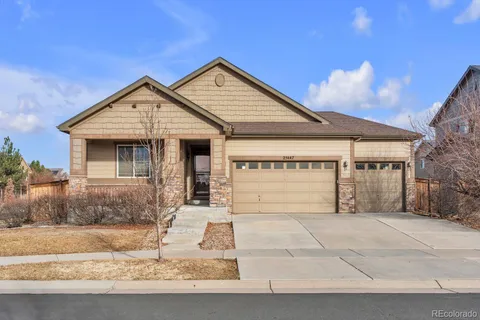 a front view of a house with garage