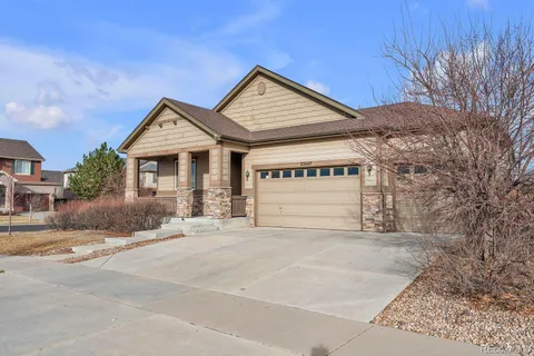 a view of a house with a yard and garage