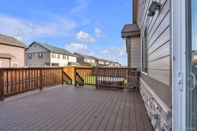 a view of balcony with wooden floor