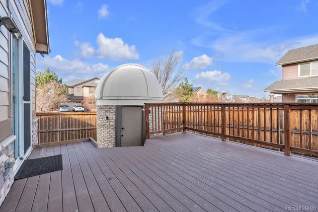 a view of a balcony with wooden floor