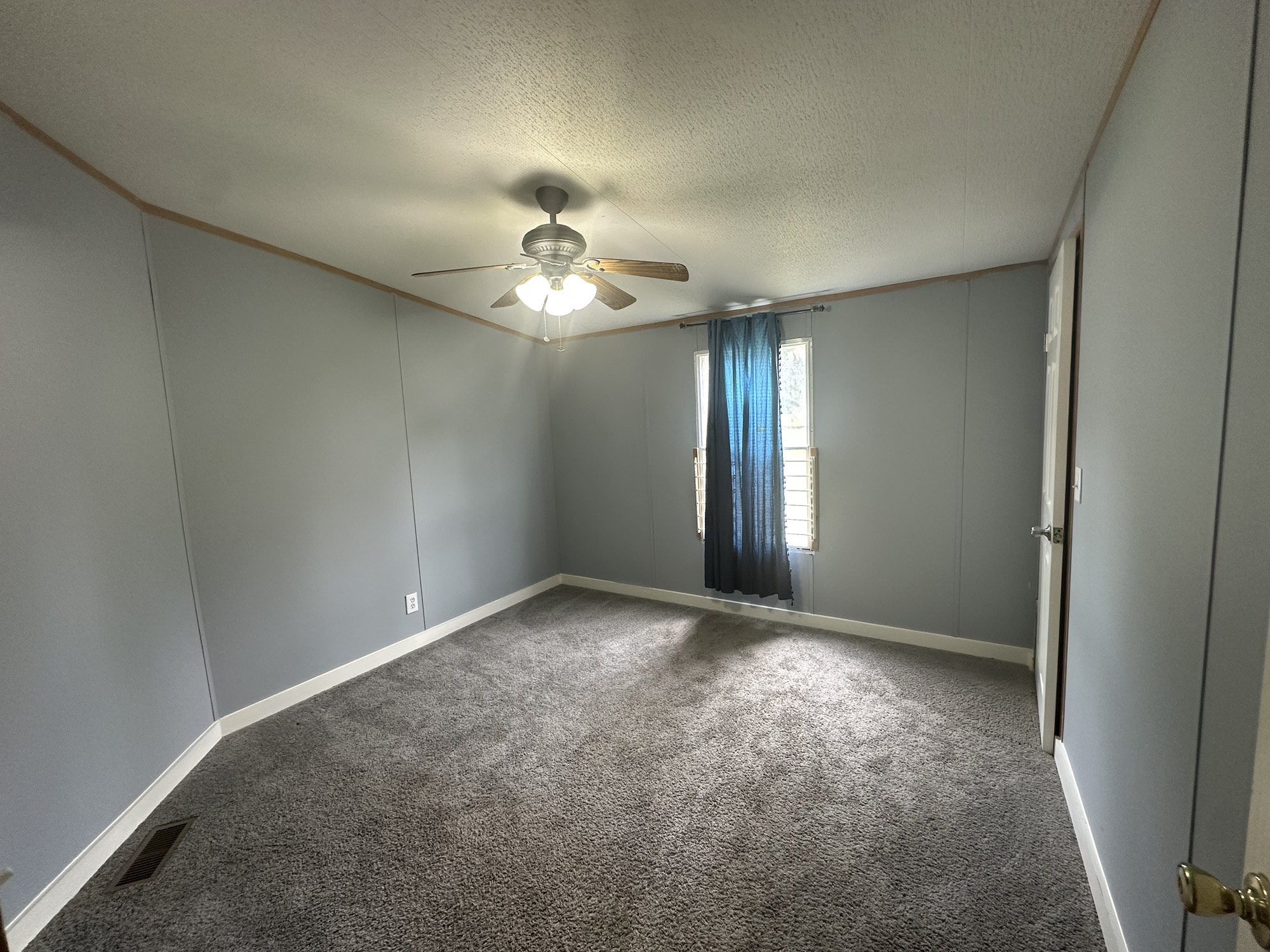 2229 Meekins Road Cleveland, TX 77328 - Photo 20 of 48 an empty room that has a chandelier fan and a window