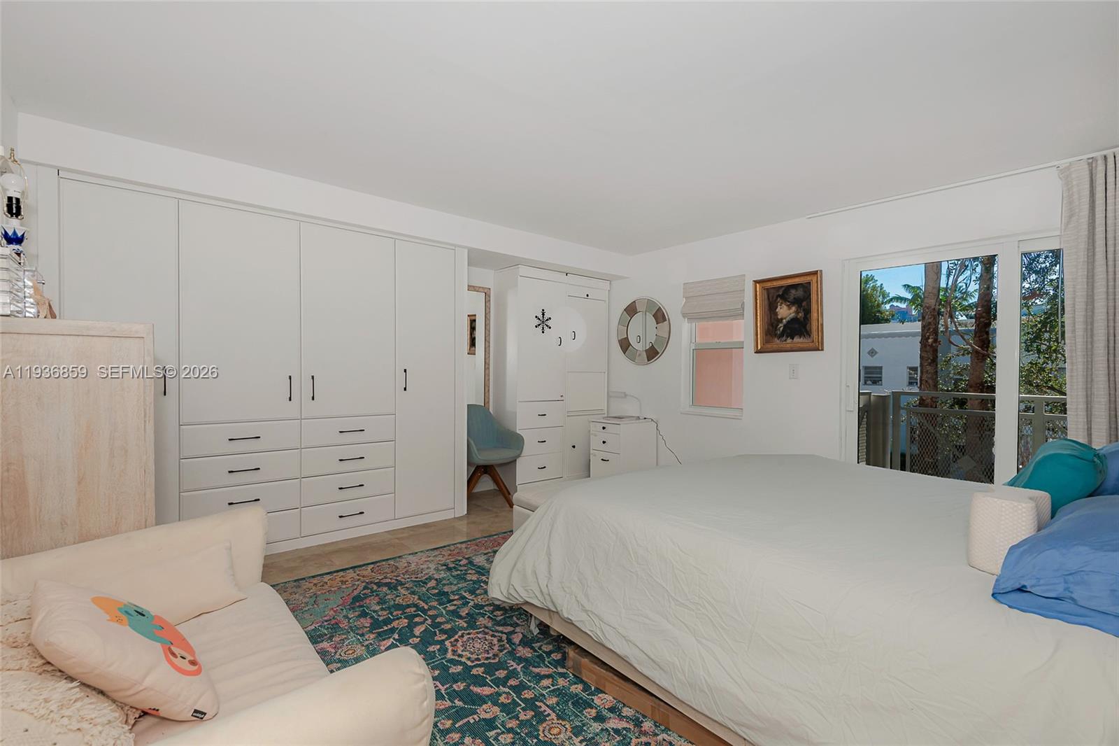 1005 8th Street, Unit 204 Miami Beach, FL 33139 - Photo 13 of 33 a bedroom with a bed and a window
