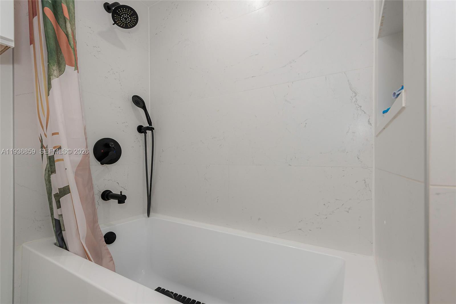 1005 8th Street, Unit 204 Miami Beach, FL 33139 - Photo 17 of 33 a bathroom with a glass shower door