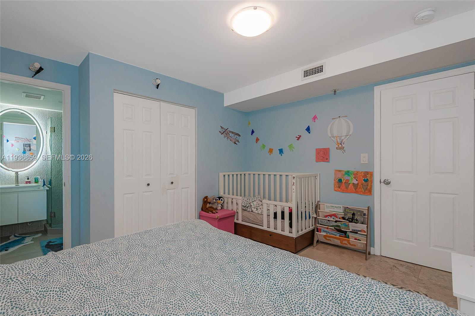 1005 8th Street, Unit 204 Miami Beach, FL 33139 - Photo 20 of 33 a bedroom with furniture and a couch