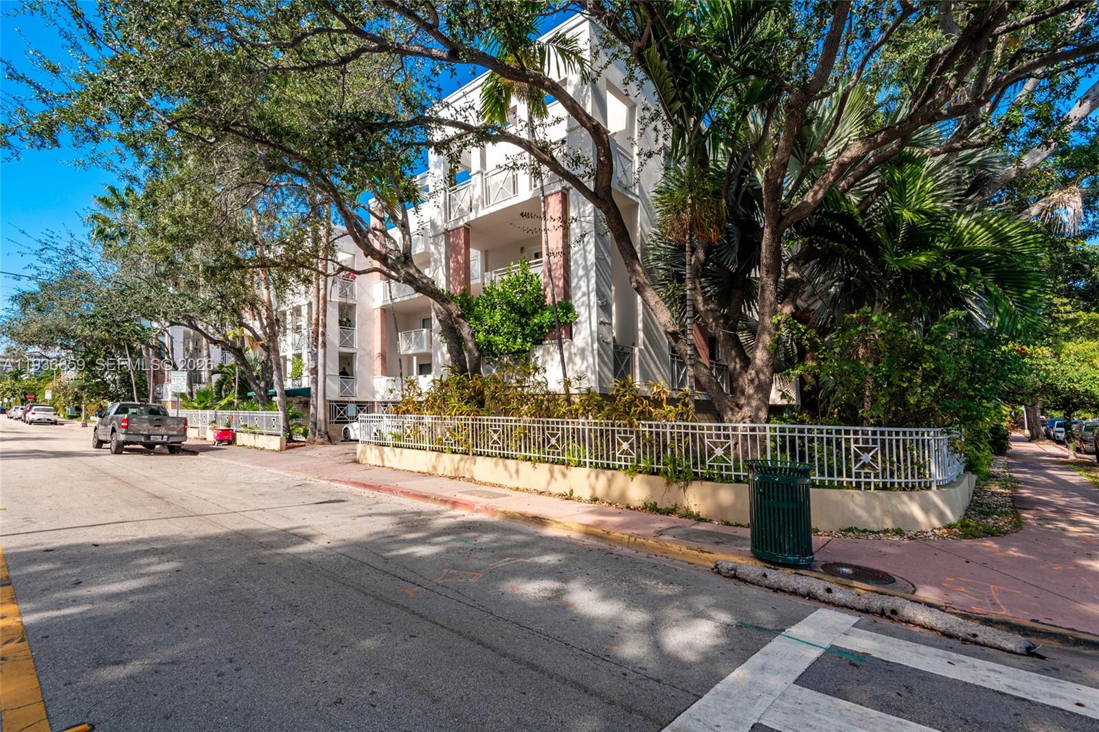 1005 8th Street, Unit 204 Miami Beach, FL 33139 - Photo 28 of 33 a row of palm trees in front of house