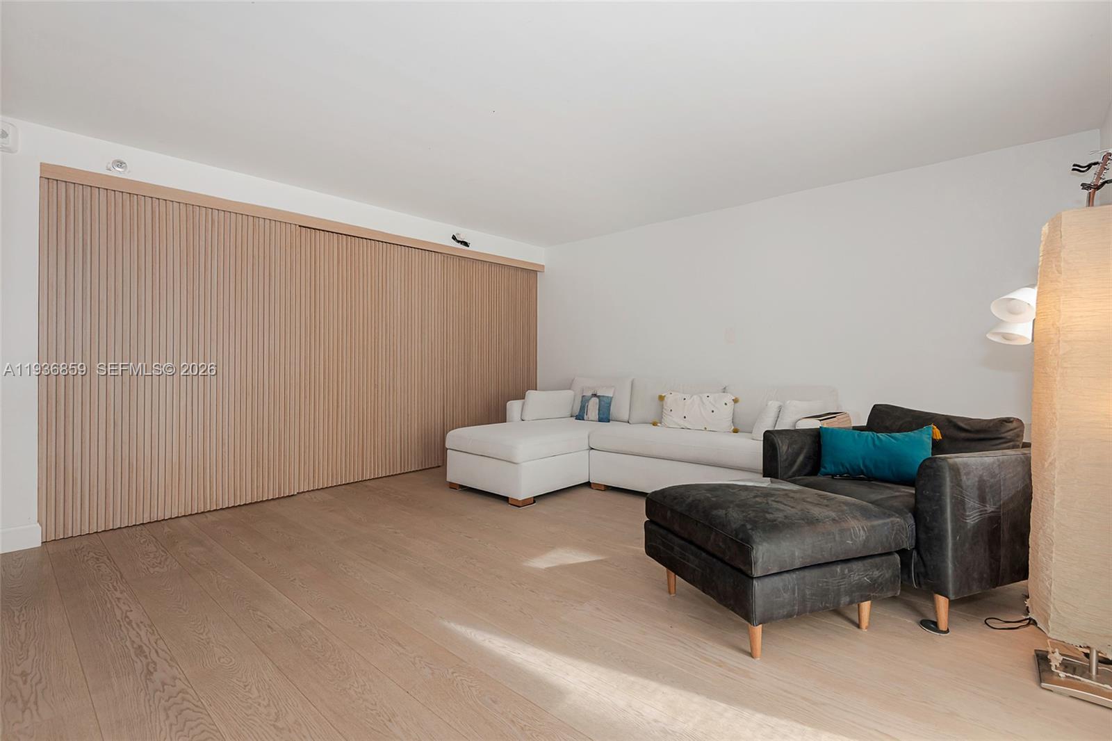 1005 8th Street, Unit 204 Miami Beach, FL 33139 - Photo 4 of 33 a living room with furniture and a couch