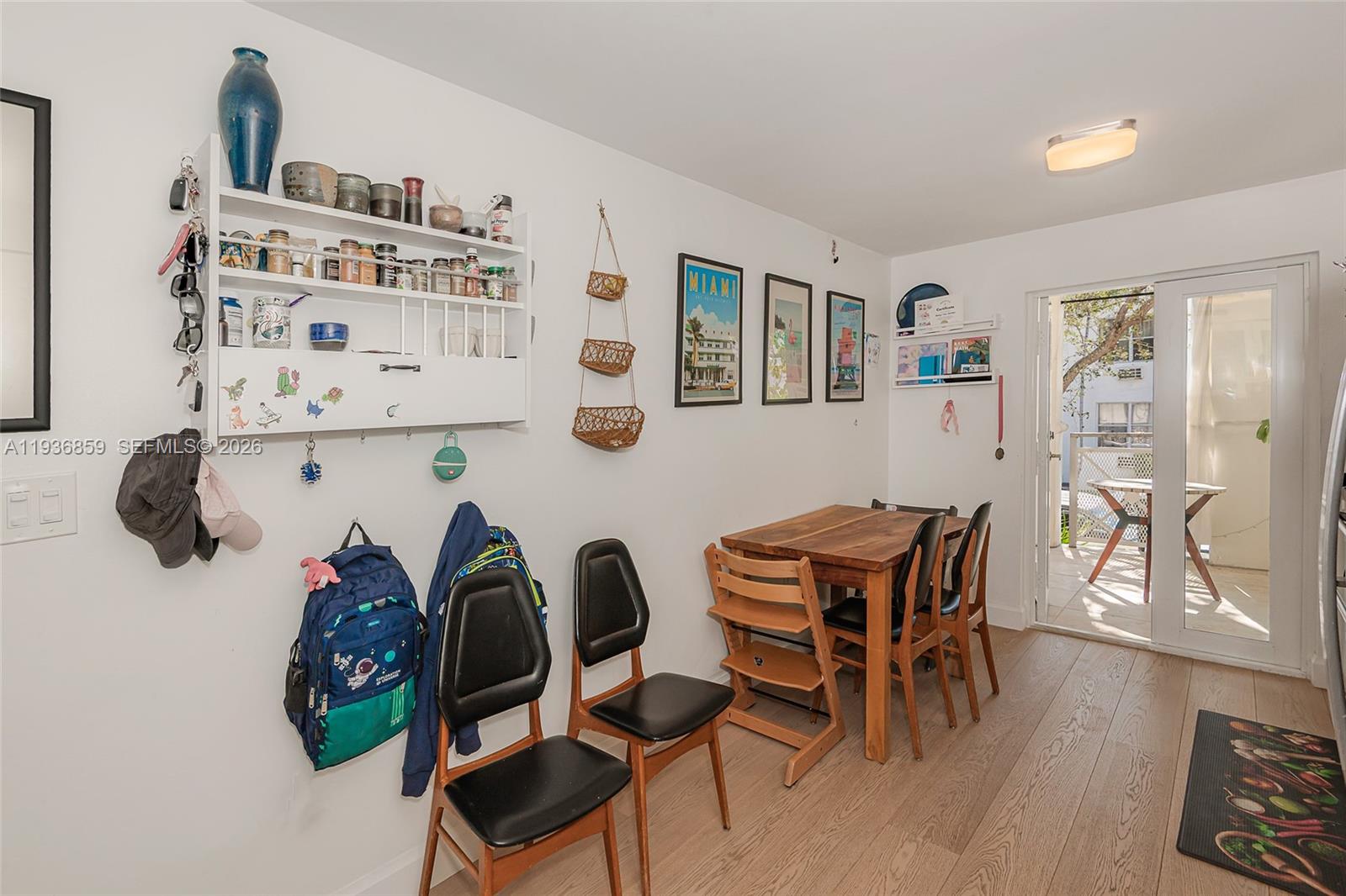 1005 8th Street, Unit 204 Miami Beach, FL 33139 - Photo 10 of 33 a dining room with furniture and wooden floor