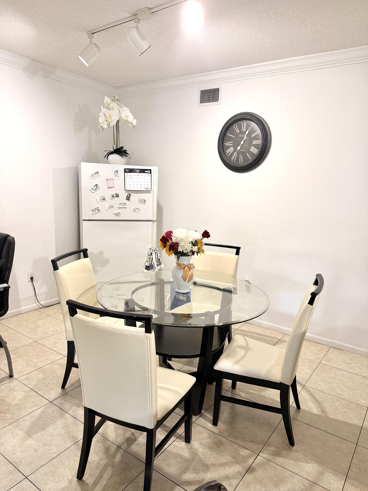 6020 West Sample Road, Unit 303 Coral Springs, FL 33067 - Photo 10 of 17 a view of a dining room with furniture