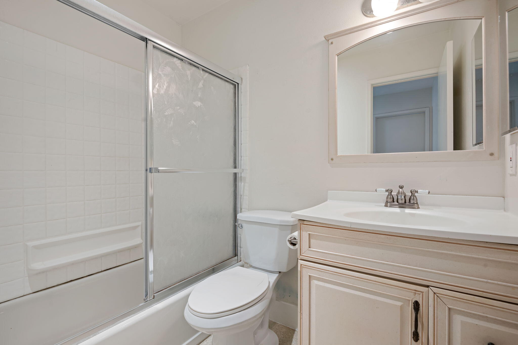 7344 Davenport Road Goleta, CA 93117 - Photo 16 of 21 a bathroom with a granite countertop toilet sink vanity and mirror
