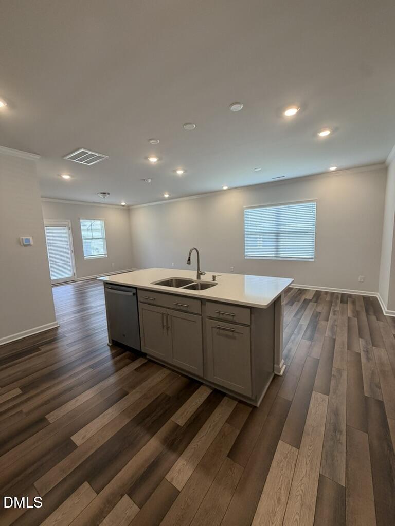 2509 Salt River Lane Raleigh, NC 27616 - Photo 10 of 34 a kitchen with a sink and wooden floor