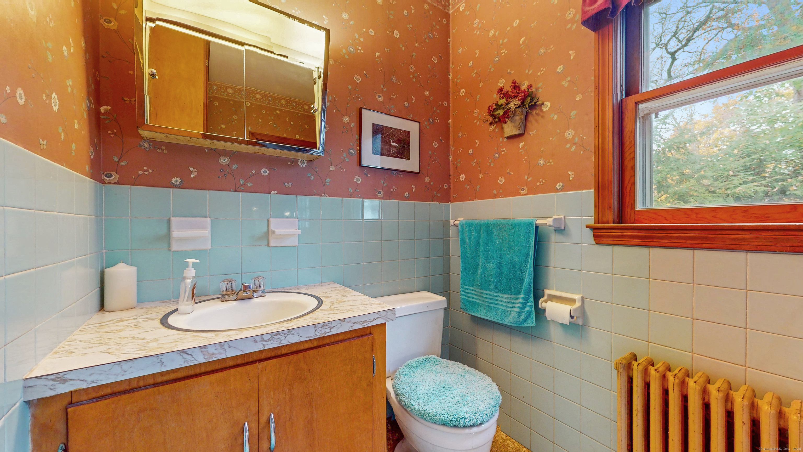 59 Elm Street Windsor Locks, CT 06096 - Photo 19 of 38 a bathroom with a toilet sink and mirror