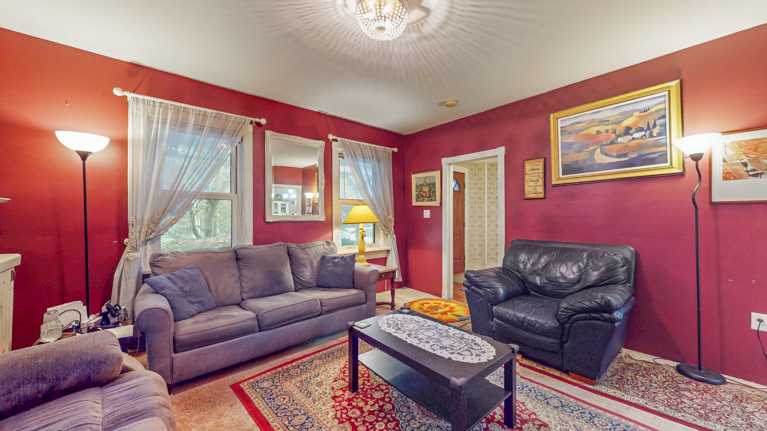 59 Elm Street Windsor Locks, CT 06096 - Photo 2 of 38 a living room with furniture and a large window