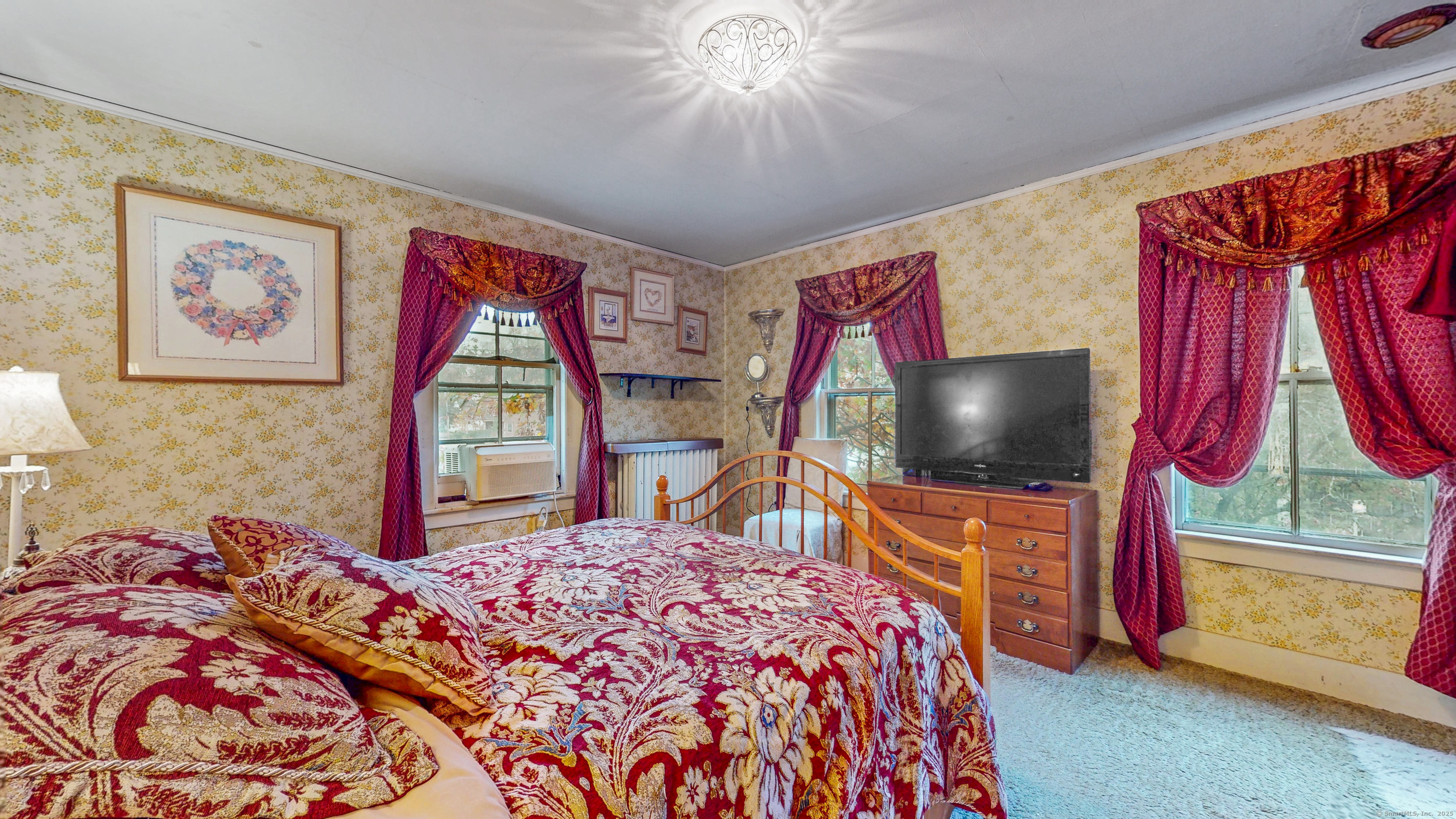 59 Elm Street Windsor Locks, CT 06096 - Photo 23 of 38 a bedroom with a bed and a flat screen tv