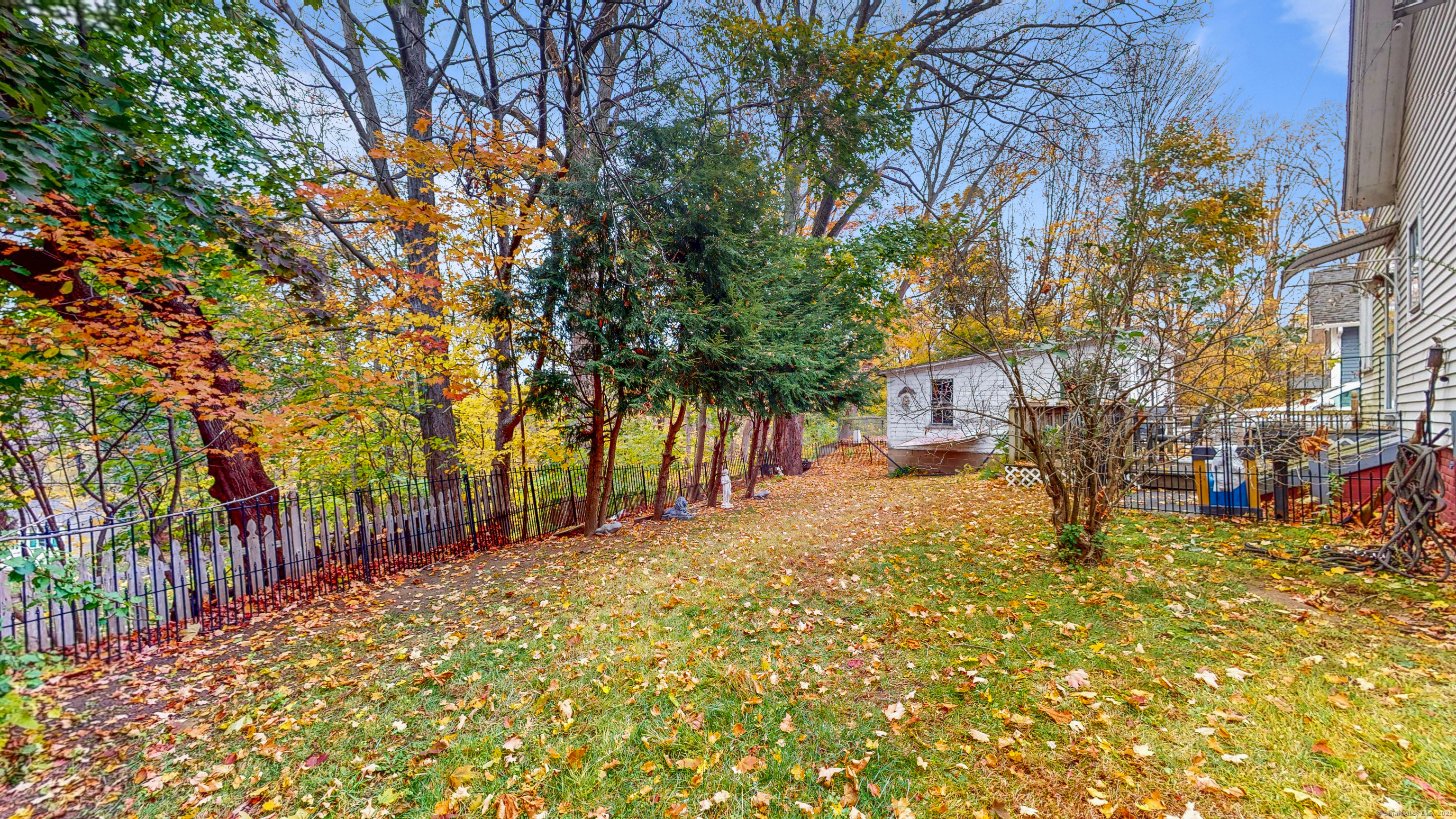 59 Elm Street Windsor Locks, CT 06096 - Photo 31 of 38 a view of a yard with plants and trees