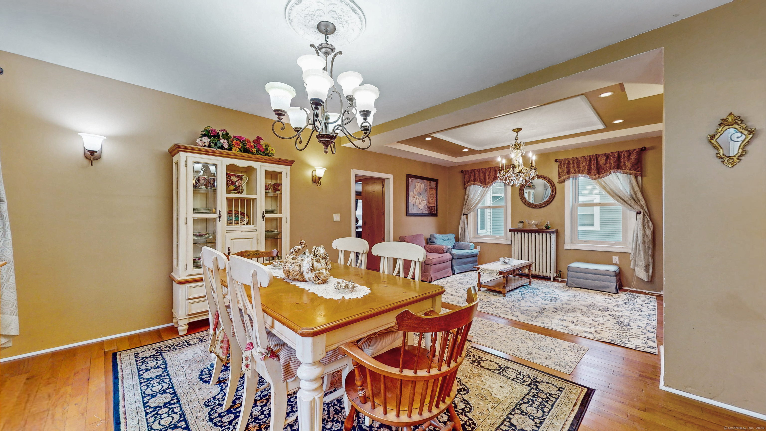 59 Elm Street Windsor Locks, CT 06096 - Photo 6 of 38 a view of a dining room with furniture a chandelier and wooden floor