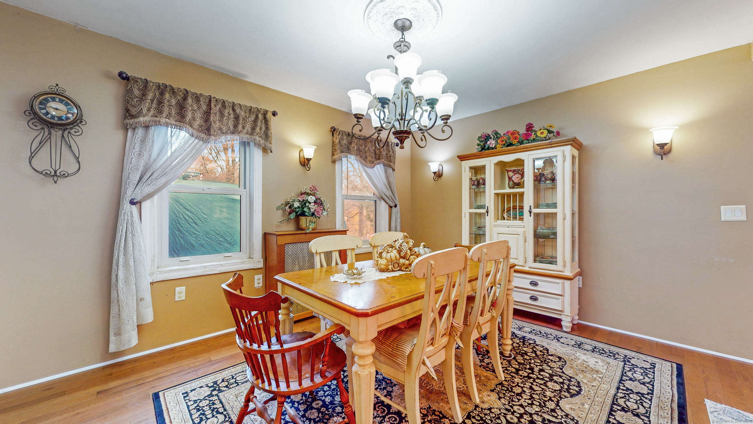 59 Elm Street Windsor Locks, CT 06096 - Photo 7 of 38 a dining room with furniture a chandelier and wooden floor